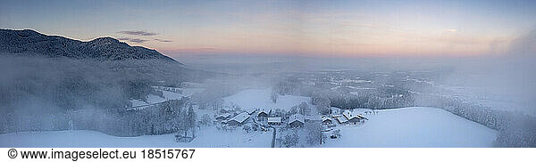 Germany  Bavaria  Fischbach  Panoramic view of secluded mountain village at foggy winter dusk