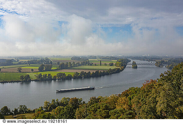 Germany  Bavaria  Fog over container ship sailing along Danube river near Regensburg