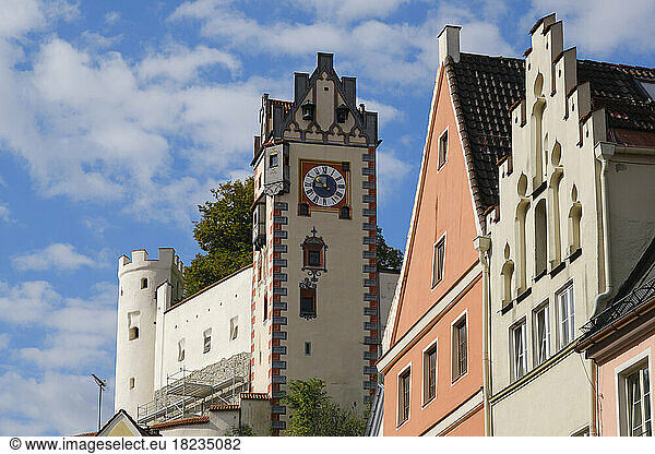 Germany  Bavaria  Fussen  Clock tower ofÂ Fussen Castle with housesÂ in foreground