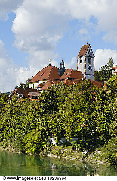 Germany  Bavaria  Fussen  St. Mangs Abbey with bank of Lech river in foreground