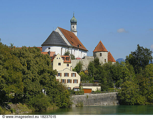 Germany  Bavaria  Fussen  St. Stephan church on bank of Lech river