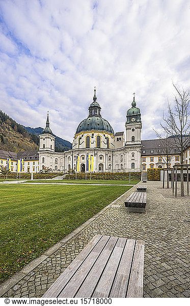 Germany  Bavaria  Garmisch-Partenkirchen  Empty benches in Ettal Abbey courtyard