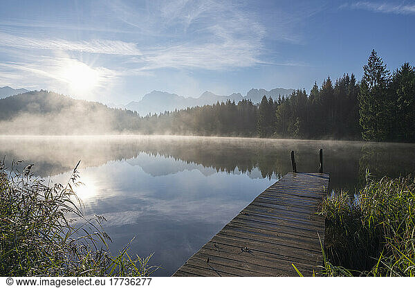 Germany  Bavaria  Geroldsee lake at foggy sunrise