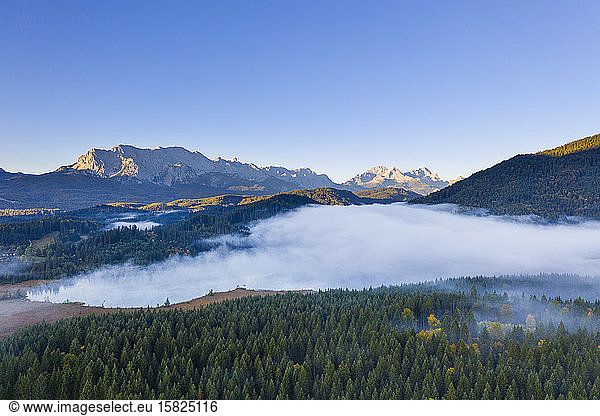 Germany  Bavaria  Krun  Drone view of Barmsee lake shrouded in thick fog