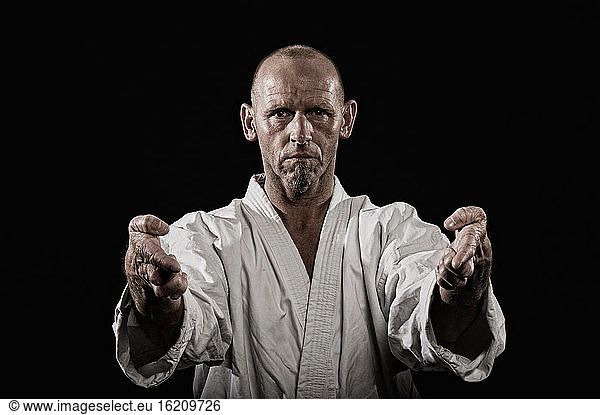 Germany  Bavaria  Mature man doing karate  portrait