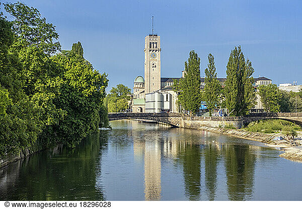 Germany  Bavaria  Munich  Arch bridge over river Isar with tower of Deutsches Museum in background