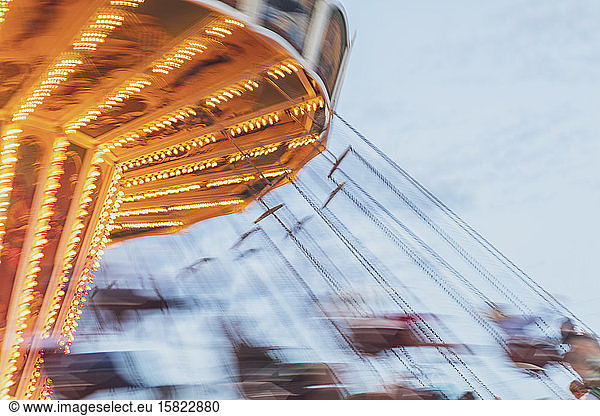 Germany  Bavaria  Munich  Chain swing carousel spinning during Oktoberfest