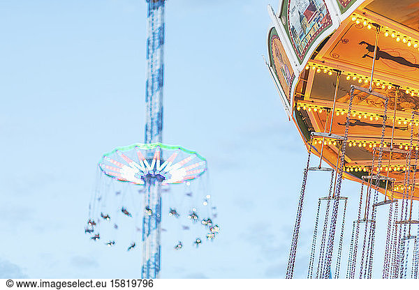 Germany  Bavaria  Munich  Chain swing carousel with Bayern Tower in background
