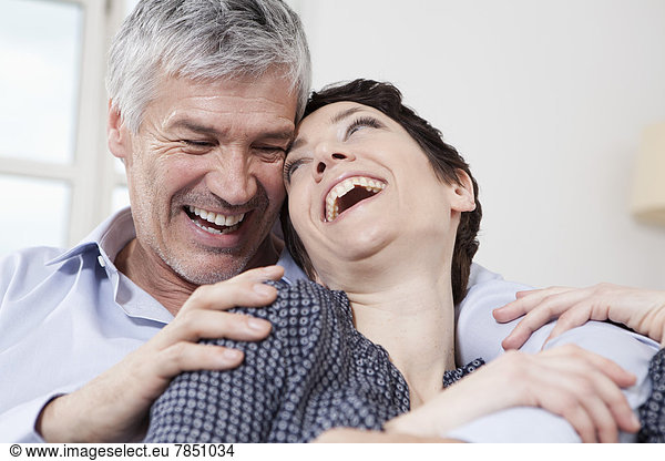 Germany Bavaria Munich Couple at home smiling