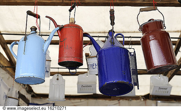 Germany  Bavaria  Munich  Old cans hanging in Auer Dult market