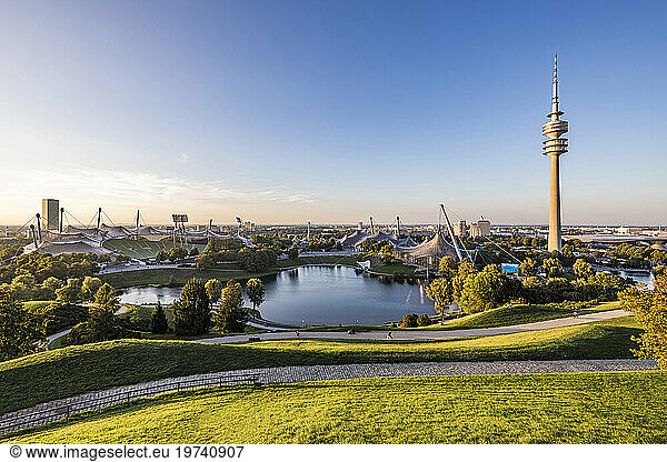Germany  Bavaria  Munich  Olympic Park at dusk with Olympic Tower  BMW Building and pond in background