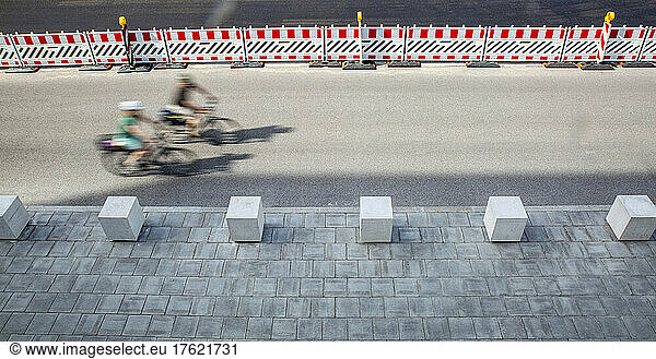 Germany  Bavaria  Munich  Two cyclists in motion