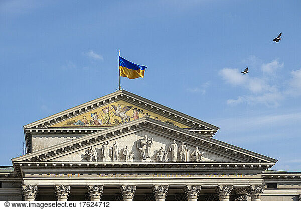 Germany  Bavaria  Munich  Ukrainian flag fluttering on roof of Residence Theatre