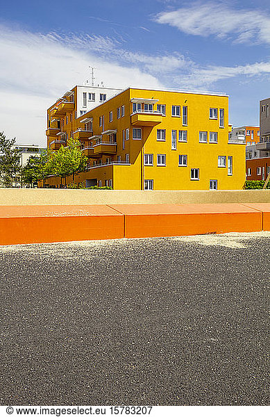 Germany  Bavaria  Munich  Yellow painted residential building in Theresienpark