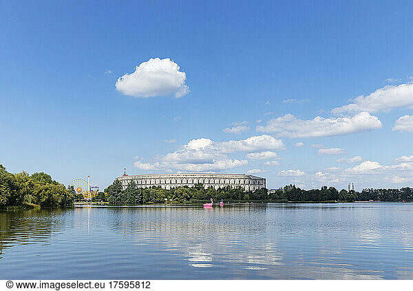 Germany  Bavaria  Nuremberg  Sky over Grosser Dutzendteich lake with Congress Hall in background