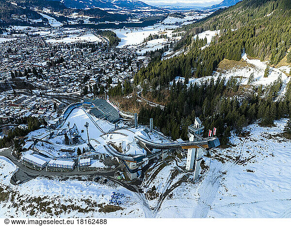 Germany  Bavaria  Oberstdorf  Aerial view of ski resort and surrounding town in winter