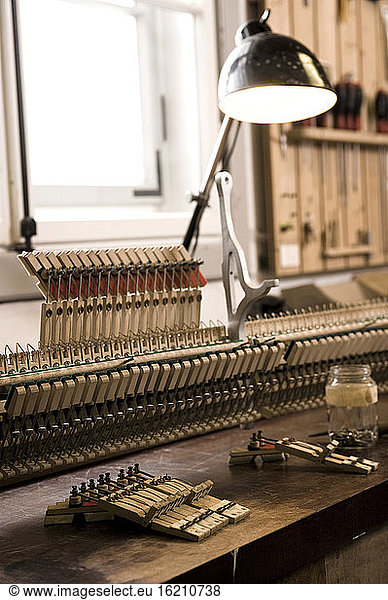 Germany  Bavaria  Piano keys for repairing at workshop  close up