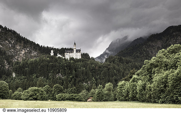 Germany  Bavaria  Schwangau  Neuschwanstein Castle and dark clouds