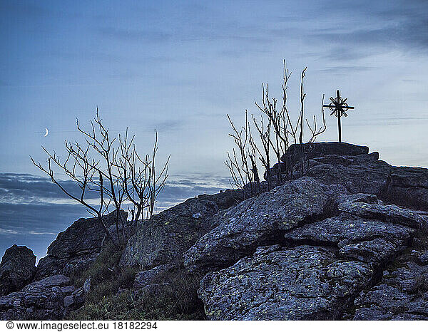 Germany  Bavaria  Summit cross on Zwercheck mountain at dusk