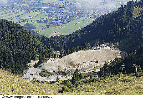 Germany  Bavaria  Upper Bavaria  Bavarian Prealps  Isarwinkel  construction site  reservoir for snowmaking at Brauneck near Lenggries