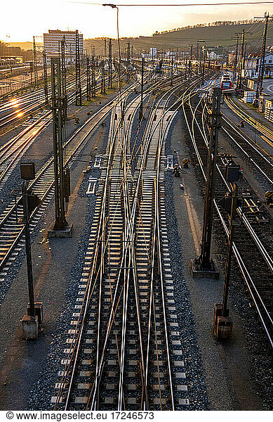 Germany  Bavaria  Wurzburg  Empty railroad tracks at sunset