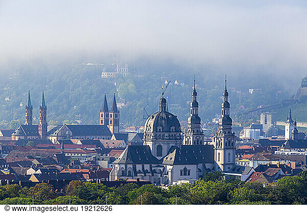 Germany  Bavaria  Wurzburg  Fog gathering over St John in Stift Haug