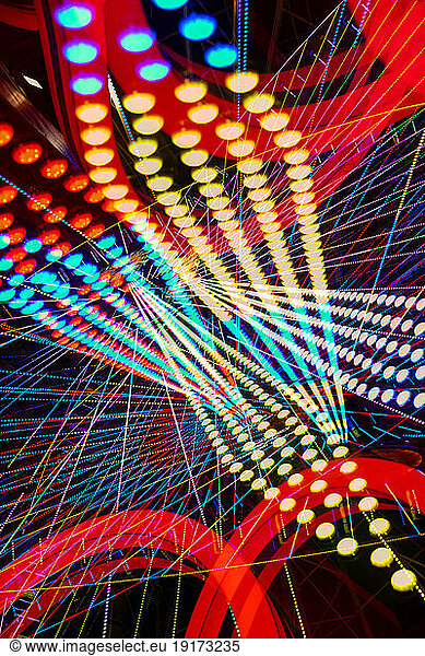 Germany  Bavaria  Wurzburg  Multiple exposure of spinning Ferris wheel at night
