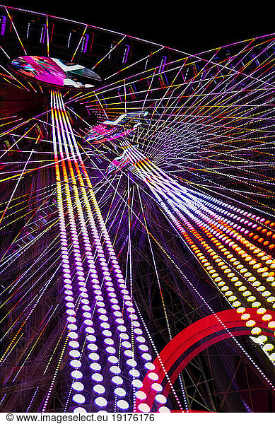 Germany  Bavaria  Wurzburg  Multiple exposure of spinning Ferris wheel at night