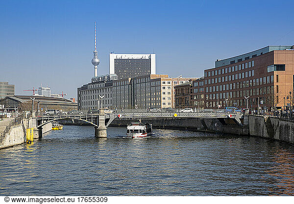 Germany  Berlin  Bridge stretching over river Spree with buildings of Mitte district in background