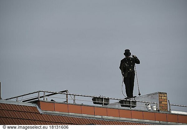 Germany  Berlin  29. 01. 2021  chimney sweep at work on a roof  Europe