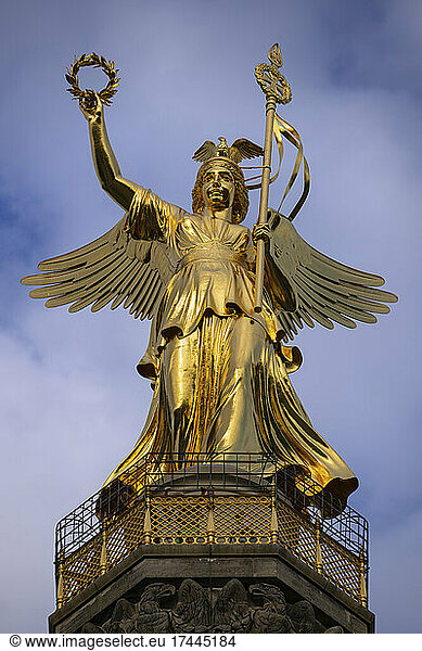 Germany  Berlin  Gold colored statue of goddess Victoria standing on top of Victory Column