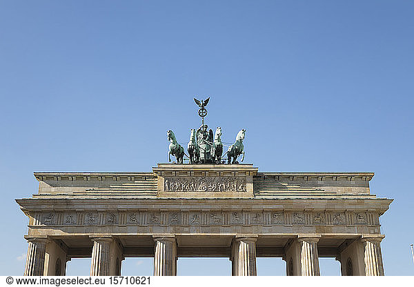 Germany  Berlin  Low angle view of Brandenburg Gate standing against clear blue sky