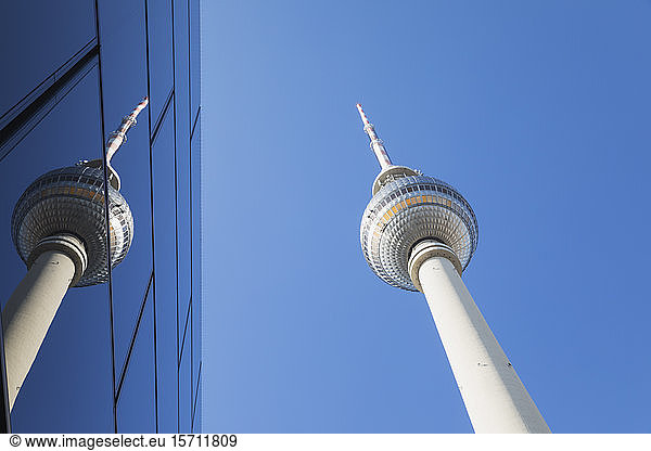 Germany  Berlin  Low angle view of TV Tower and glass building