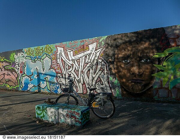 Germany  Berlin  30. 07. 2021  Mauerpark  graffiti wall  head of a coloured boy  by graffiti artist Eme Freethinker  Europe