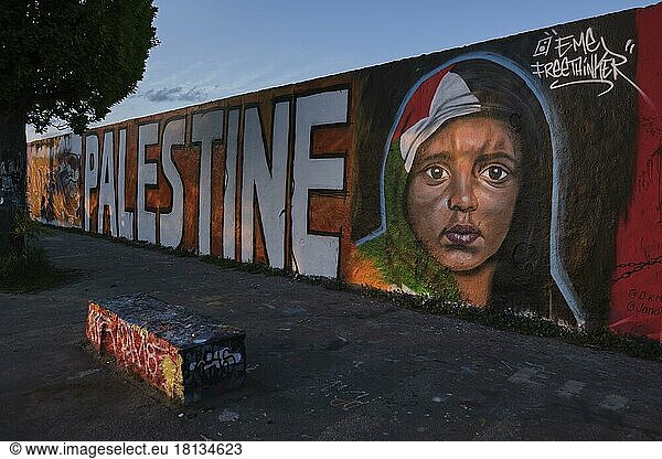Germany  Berlin  23. 05. 2021  Mauerpark  graffiti wall  head of a Palestinian child  flag as headscarf  by graffiti artist Eme Freethinker  Europe