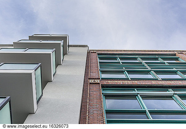 Germany  Berlin  new residential building and refurbished old industrial building side by side