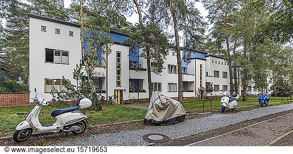 Germany  Berlin  Panorama of motor scooters parked in front of Berlin Modernism Housing Estates
