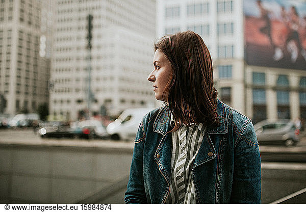 Germany  Berlin  Portrait of young brunette wearing denim jacket