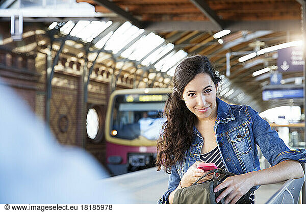 Germany  Berlin  portrait of young female tourist on city trip