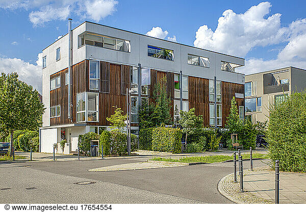 Germany  Berlin  Street in front of modern suburban row houses in new development area