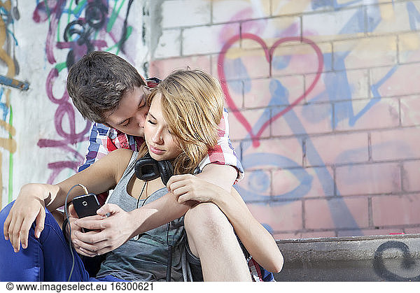 Germany  Berlin  Teenage couple falling in love