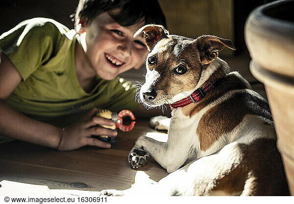 Germany  Boy playing with dog