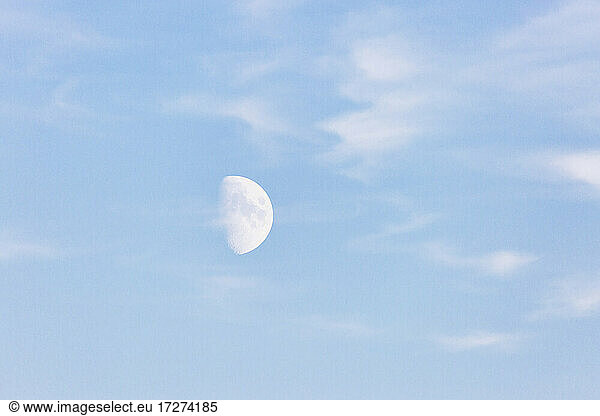 Germany  Brandenburg  Linum  Daytime moon against pastel blue sky