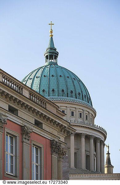 Germany  Brandenburg  Potsdam  Dome of Saint Nicholas Church behind roof of residential building