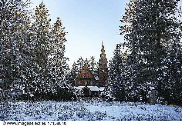Germany  Brandenburg  Stahnsdorf  Wooden church in winter scenery