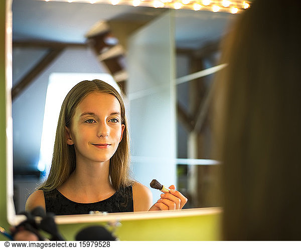 Germany  Brandenburg  Teenage girl applying make up