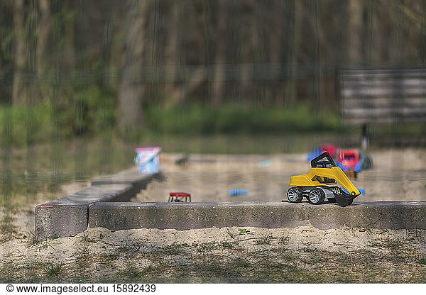Germany  Brandenburg  Toys left in sandbox of empty playground during COVID-19 epidemic