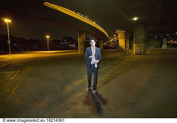 Germany  Cologne  Young man under motorway bridge  portrait