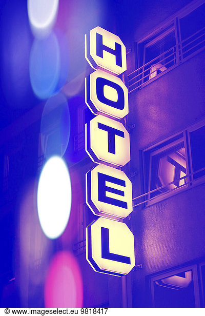 Germany  Duesseldorf  facade of hotel with lighted sign at night