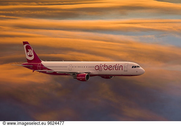 Germany  flying airbus A321-211 of Air Berlin at evening light